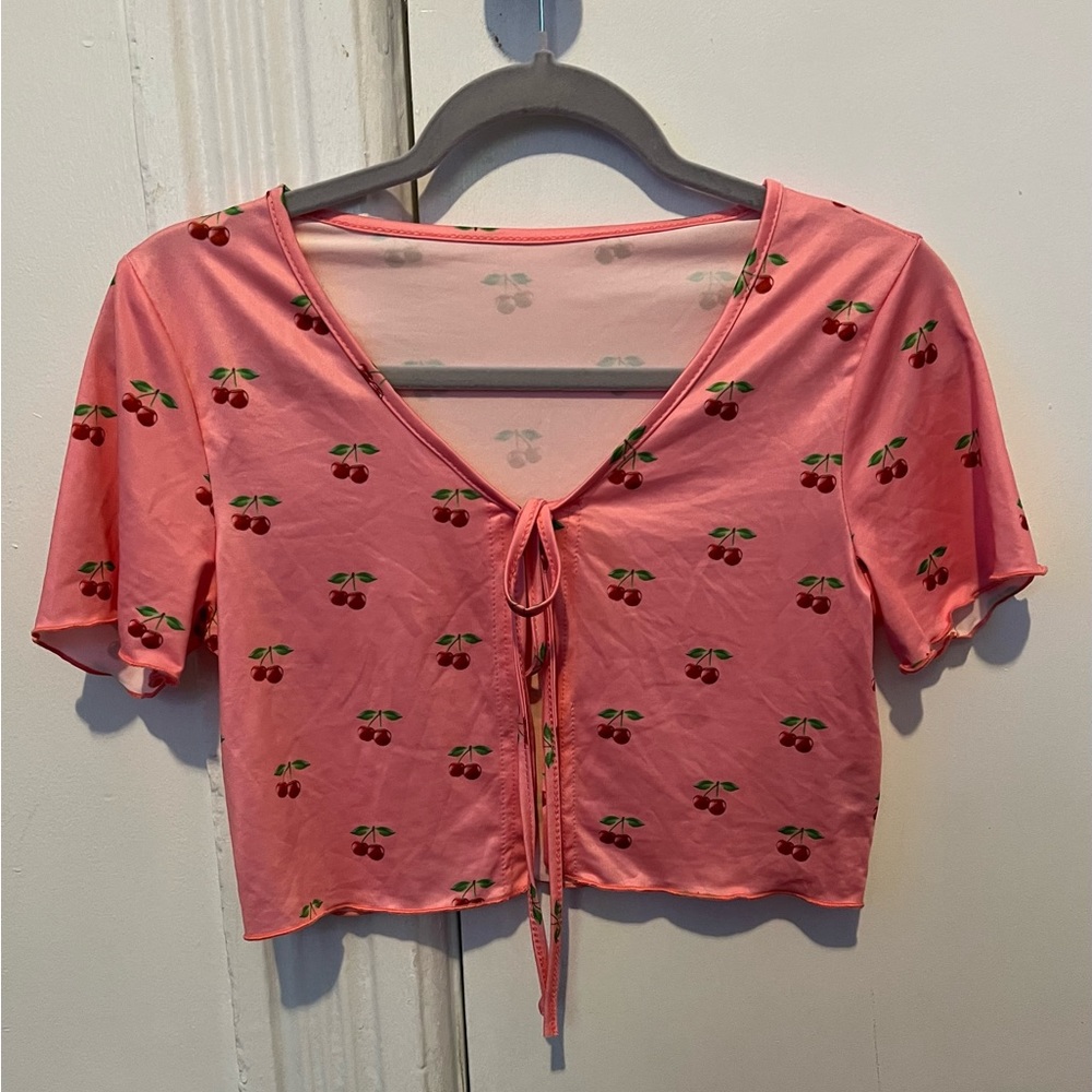 Pink crop top with cherries graphic